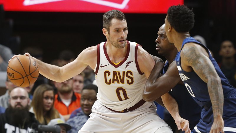  In this Oct. 19, 2018, file photo, Cleveland Cavaliers' Kevin Love, left, is double-teamed by Minnesota Timberwolves' Anthony Tolliver and Jeff Teague, right, in the first half of an NBA basketball game, in Minneapolis. Love could miss significant time with a foot injury that has bothered him since the preseason. Love will sit out his third straight game on Tuesday, Oct. 30, 2018, as the winless Cavs host Atlanta and look to end a six-game winless streak to start the season. (AP Photo/Jim Mone, File)