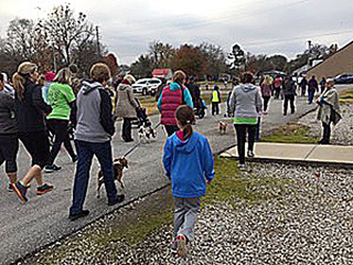 COURTESY PHOTO/The annual Turkey Trot is a family affair, with furry friends tagging along for the trot as well. Enjoy colorful fall foliage while travelling the 3.1 mile loop through Southwest City.