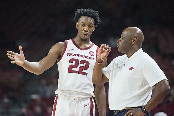 Gabe Osabuohien of Arkansas talks to head coach Mike Anderson in the second half vs Tusculum Friday, Oct. 26, 2018, during an exhibition game in Bud Walton Arena in Fayetteville.