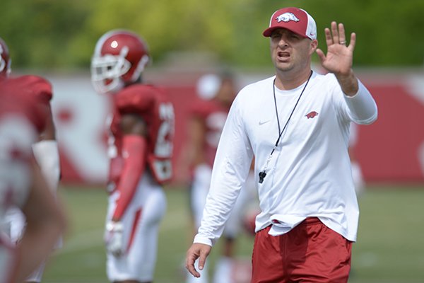 Arkansas assistant coach Barry Lunney Jr. directs his players Thursday, Aug. 9, 2018, during practice at the university's practice facility in Fayetteville. Visit nwadg.com/photos to see more photos from practice.