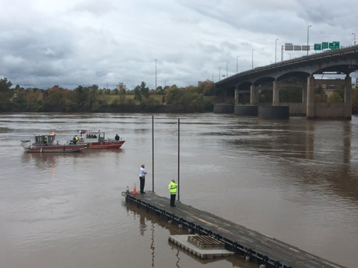 Crews search the water near the I-30 Arkansas River bridge on Thursday afternoon.
