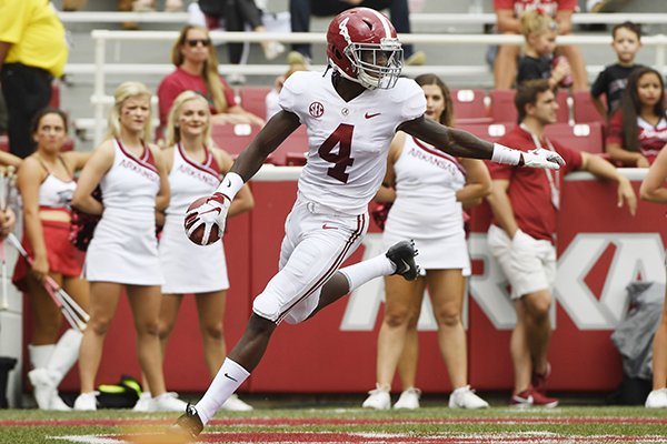 Alabama receiver Jerry Jeudy celebrates after scoring a touchdown against Arkansas in the first half of an NCAA college football game Saturday, Oct. 6, 2018, in Fayetteville, Ark. (AP Photo/Michael Woods)
