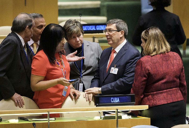 Anayansi Rodriguez Camejo (second from left), Cuba’s ambassador to the U.N., and Cuban Foreign Minister Bruno Rodriguez (second from right) confer Thursday with members of their delegation. 