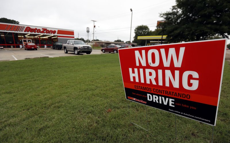 FILE- In this Sept. 27, 2018, file photo a bilingual help wanted sign for Auto Zone is posted outside the store in Canton, Miss. Against the backdrop of next week&#x2019;s midterm elections, the U.S. job market is the healthiest it&#x2019;s been in at least two decades. And with another strong hiring report expected Friday, Nov. 2, some barometers of the job market suggest that it has room to strengthen further. (AP Photo/Rogelio V. Solis, File)