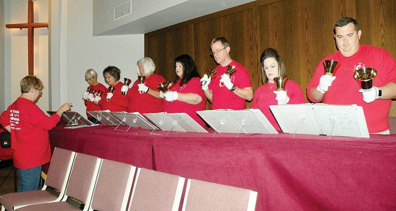 Kate Cole, left, directs the Perryville United Methodist Church Bell Choir in a rehearsal for the choir’s participation in the Bells of Peace observance on Nov. 11. Members of the bell choir include, from left, Nancy O’Such, Cindy Langston, Carolyn McCallister, the Rev. Chanda Adams, Andy Adams, Jennifer Cody and Cole Cody.