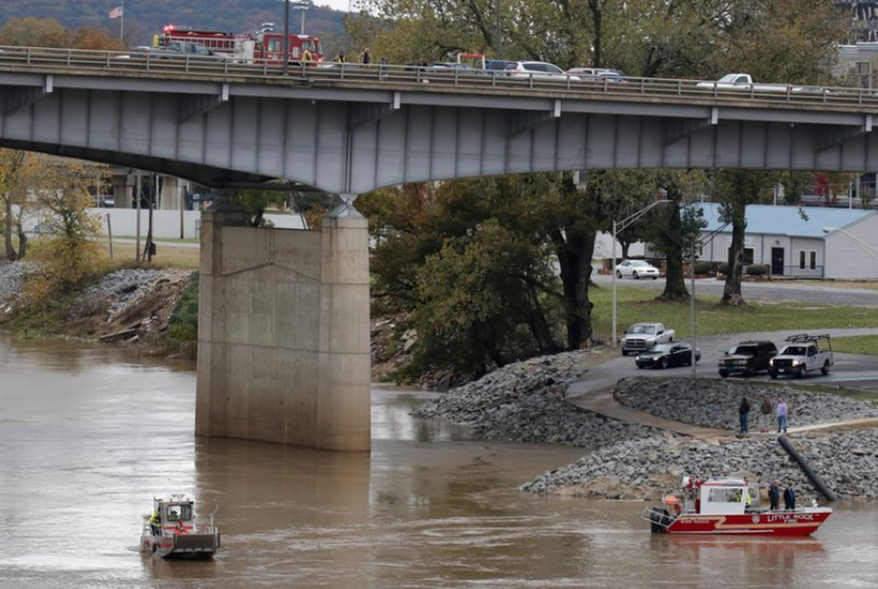 Little Rock and North Little Rock water rescue boats maneuver beneath the I-30 bridge on the North Little Rock side of the Arkansas River Thursday afternoon.
