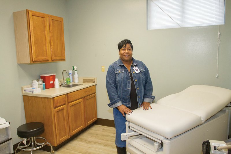 Patrica Henderson, administrator for the Jacksonville Health Unit, stands in one of the remodeled examination rooms, part of a $600,000 expansion that includes a new waiting area for patients.