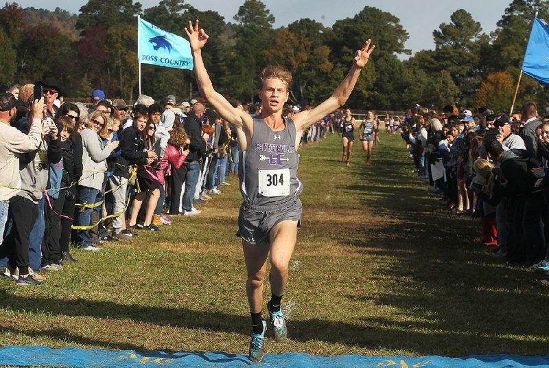 Fayetteville’s Camren Fischer crosses the finish line to win his third consecutive Class 6A boys cross country title. Fischer’s winning time was 16 minutes, 19.9 seconds. 