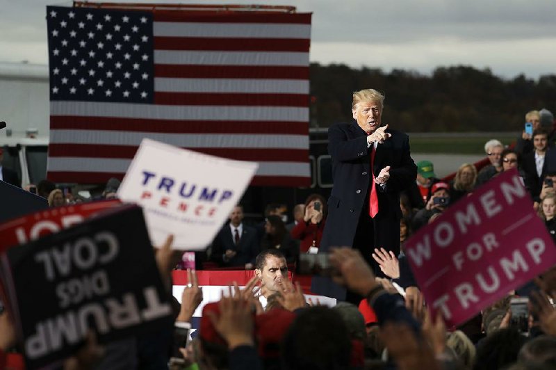 President Donald Trump acknowledges supporters at a campaign rally Friday in Huntington, W.Va. 