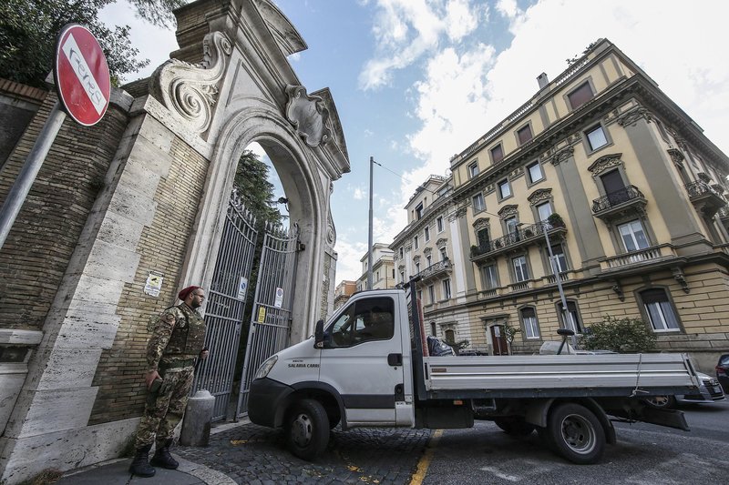 A military soldier guards the entrance of the Apostolic Nunciature, the Vatican's embassy to Italy, in Rome, Wednesday, Oct. 31, 2018. The Vatican said Tuesday that human bones were found during renovation work near its embassy to Italy, reviving talk about one of the Holy See's most enduring mysteries &#x2014; the fate of the 15-year-old daughter of a Vatican employee who disappeared in 1983. (Fabio Frustaci/ANSA via AP)