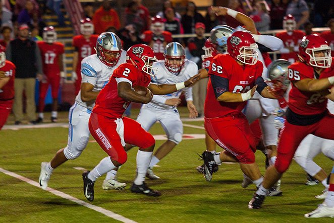 #2 Derrick Deuce Wise of Northside follows the blocking of #66 Zach Stephens on Friday night.