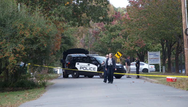 Crime scene technicians arrive Saturday at the site of a fatal shooting in Little Rock.
