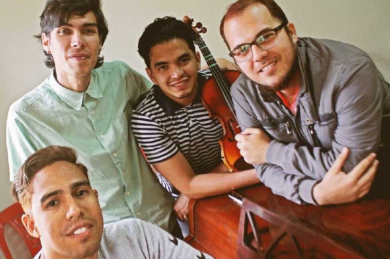 Samir Sanz (from left), Cesar Chang, Pedro Changir and Magdiel Hernandez pose at the National School of Peruvian Musicians in Lima. The young Venezuelan musicians consider themselves lucky to be working at the school. “I’ve bumped into people here in Lima playing music on the street for change who are maestros, who were very important people in Venezuela,” Sanz said. “I know an incredibly talented luthier who works as a mechanic.”