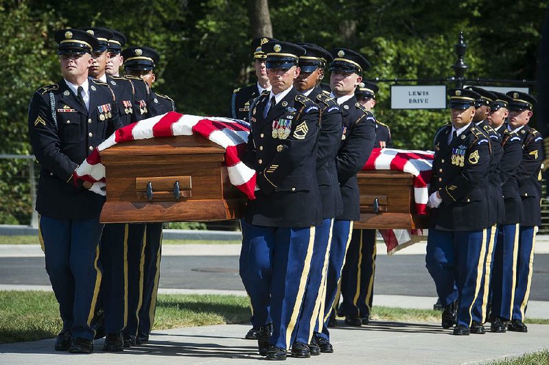 Members of the 3rd Infantry Regiment, also known as the Old Guard, carry the remains of two unknown Civil War Union soldiers to their graves in September at Arlington National Cemetery in Virginia.