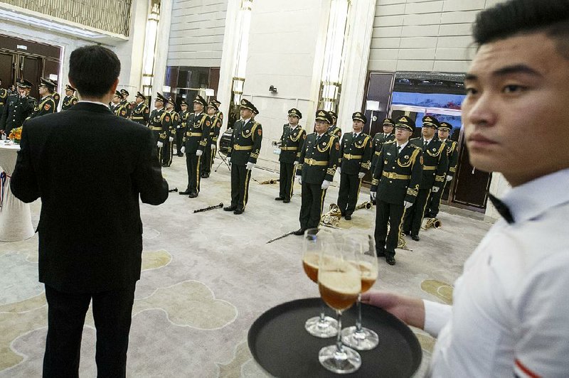 A military band attends the opening ceremony Saturday of the Dominican Republic Embassy in Beijing.