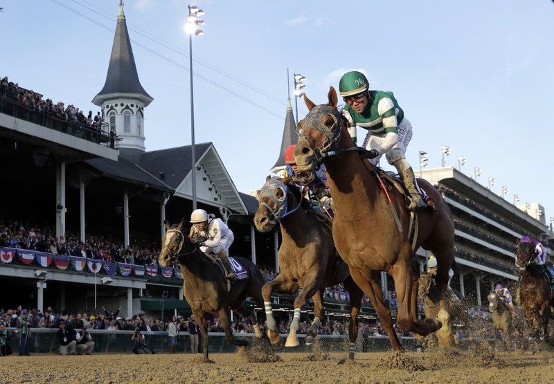 Joel Rosario rides Accelerate to victory in the Breeders' Cup Classic horse race at Churchill Downs, Saturday, Nov. 3, 2018, in Louisville, Ky. (AP Photo/Darron Cummings)
