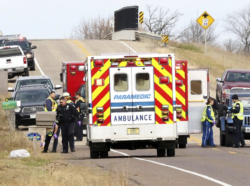 Emergency medical personnel gather at the scene of a hit-and-run accident Saturday, Nov. 3, 2018, in Lake Hallie, Wis., that killed two girls and an adult. (Steve Kinderman/The Eau Claire Leader-Telegram via AP)