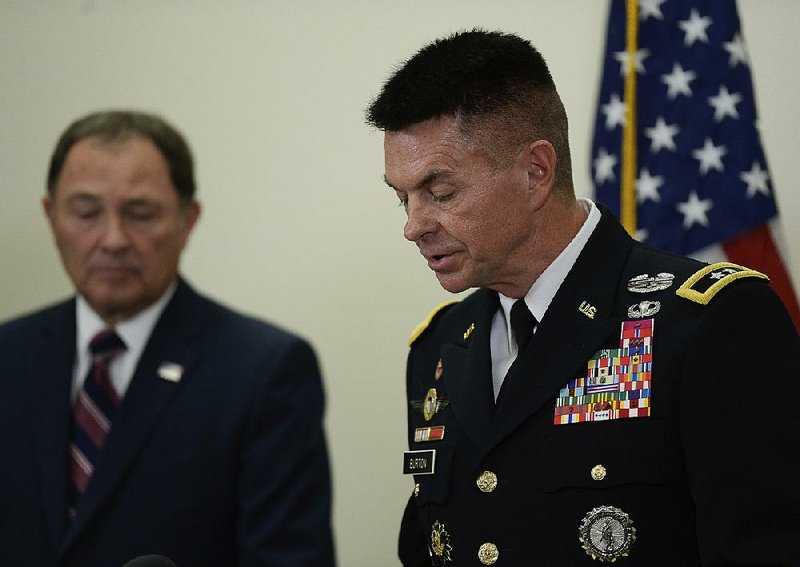 Gov. Gary Herbert (left) and Maj. Gen. Jefferson Burton address the media Sunday in Draper, Utah, concerning the death of Brent Taylor, the mayor of North Ogden, Utah, who was killed while on National Guard duty in Afghanistan. 