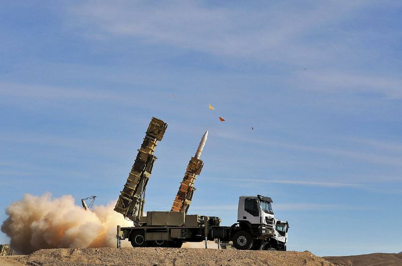 A Sayyad 2 missile is fired by the Talash air defense system during drills Monday in an undisclosed location in Iran.