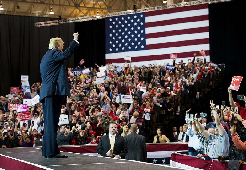 President Donald Trump acknowledges the crowd during a campaign rally at the I-X Center on Monday in Cleveland.