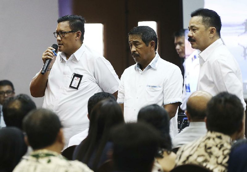 Daniel Putut Kuncoro Adi (left), director of safety and security of Lion Air, talks to relatives of the victims of the crashed Lion Air jet as President Director Edward Sirait (center) and founder and owner of the airline Rusdi Kirana listen during a news conference in Jakarta, Indonesia, on Monday.