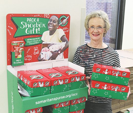 The Sentinel-Record/Richard Rasmussen HOLIDAY MINISTRY: National Collection Week for Samaritan's Purse's Operation Christmas Child begins Nov. 12, and individuals and groups are encouraged to pack shoe boxes with small gifts and supplies for children in need across the globe. Shari Coston serves as relay center coordinator for the Hot Springs area and boxes may be dropped at one of three locations, including First United Methodist Church.