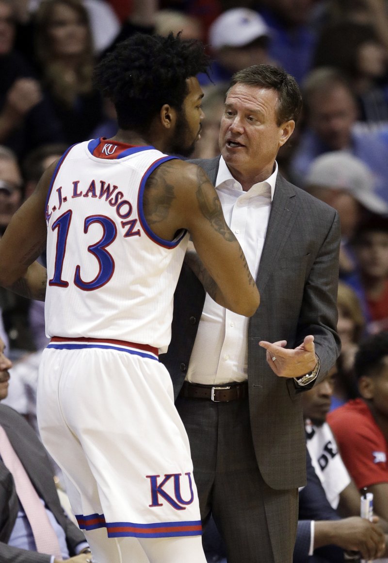 Kansas coach Bill Self talks with guard K.J. Lawson during the second half of the team's preseason NCAA college basketball game against Washburn in Lawrence, Kan., Thursday, Nov. 1, 2018. (AP Photo/Orlin Wagner)