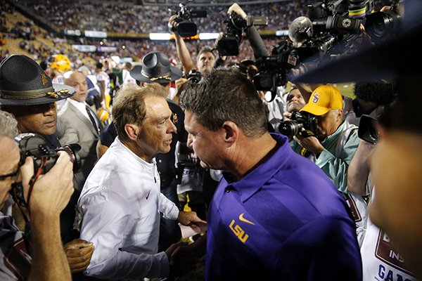 Alabama head coach Nick Saban, left, shakes hands with LSU head coach Ed Orgeron after their NCAA college football game in Baton Rouge, La., Saturday, Nov. 3, 2018. Alabama won 29-0. (AP Photo/Gerald Herbert)

