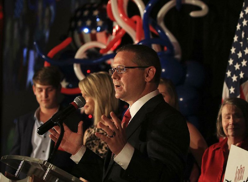 State Land Commissioner John Thurston speaks to supporters Tuesday night at a watch party in Little Rock. 
