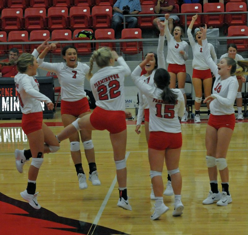 MARK HUMPHREY ENTERPRISE-LEADER Farmington volleyball players celebrate an ace during a 4-set win over Berryville on Tuesday, Sept. 18, 2018, at Cardinal Arena.