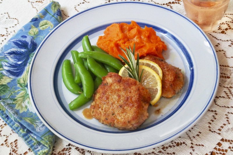 This Oct. 4, 2018 photo shows five-ingredient cheesy pork steaks in New York. This dish is from a recipe by Sara Moulton. (Sara Moulton via AP)