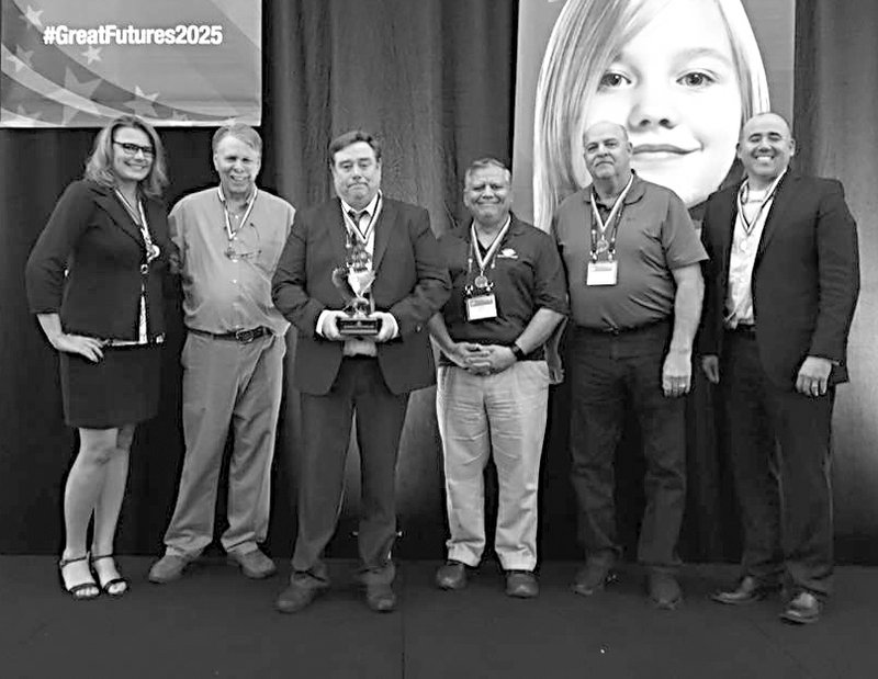 SUBMITTED Chris Shimer, CEO of the Boys and Girls Club of Western Benton County (third from left) was recently honored with the "Jim Wetherington Southwesterner Award" at the recent Boys and Girls Club of America Southwest Region Leadership Conference in Austin, Texas.