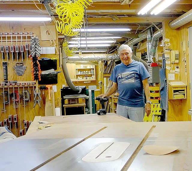 Lynn Atkins/The Weekly Vista Pete Keigley stands in his 1,400-square-foot workshop. He retired and moved to Bella Vista from Iowa almost 20 years ago.