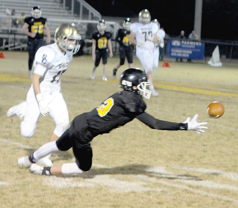 MARK HUMPHREY ENTERPRISE-LEADER Prairie Grove wingback Landon Semrad makes a diving attempt to catch a pass. Semrad recorded six catches for 42 yards converting key first downs, but the junior Tigers were defeated, 21-14, by Shiloh Christian in the 4A-1 Junior High football conference championship on Thursday.