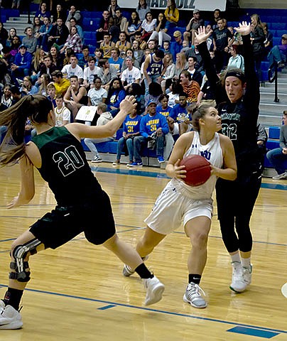 Photo courtesy of JBU Sports Information John Brown point guard Sara Williams looks for a shot during the second half of last Saturday's game against Crowley's Ridge College.