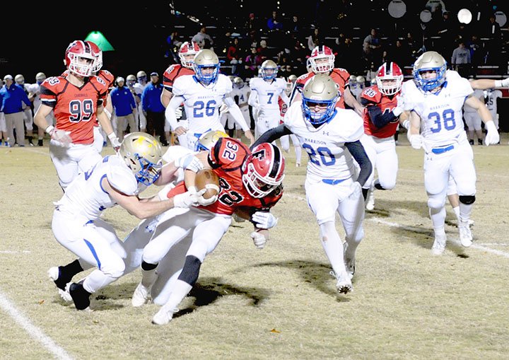 MARK HUMPHREY ENTERPRISE-LEADER Farmington senior tailback Reid Turner carries the ball against Harrison. Turner scored Farmington's only touchdown on an 85-yard run during the last game played at Allen Holland Field Friday. Harrison won 35-6.