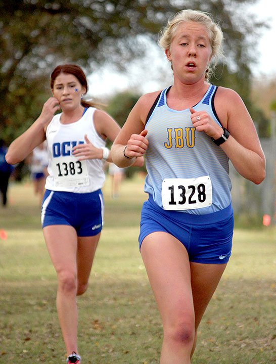 Randy Roth/Special to the Herald-Leader John Brown freshman Allika Pearson, right, of Siloam Springs, finished eighth overall at the Sooner Athletic Conference Meet on Saturday at Woodson Park in Oklahoma City. Pearson earned a spot in the NAIA National Meet on Nov. 16 in Cedar Rapids, Iowa.