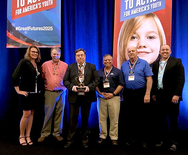 Photo submitted After receiving the award, Chris Shimer, chief executive officer of the Boys and Girls Club of Western Benton County, takes a photo with different representatives of other Boys and Girls Clubs in the organization's southwest region. Pictured (from left) are Misti Potter, CEO of the Boys and Girls Club of the Austin, Texas, area; Jon Charles, Retired CEO of the Boys and Girls Club of Central Texas; Chris Shimer - CEO of the Boys and Girls Club of Western Benton County; Carlos Martinez - Director of Operations from the Wichita Falls Boys and Girls Club; Gerald Gathright - CEO of the Boys and Girls Club of Harlingen; Ashley Bright - CEO of the Boys and Girls Club of Central Wyoming.