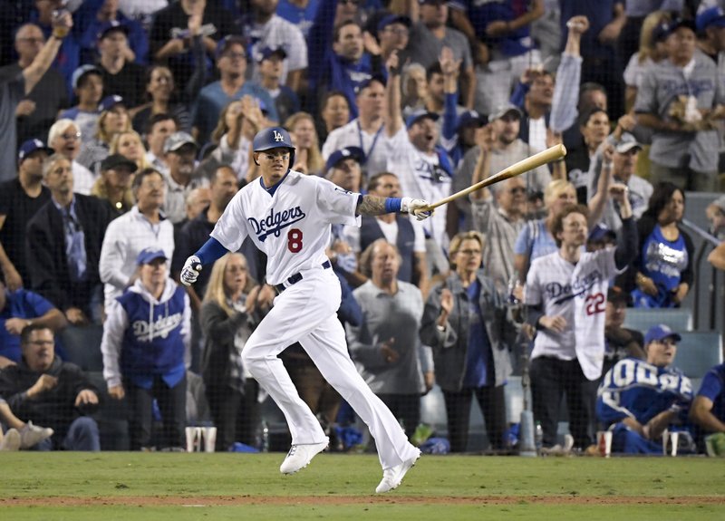  In this Oct. 26, 2018, file photo, Los Angeles Dodgers' Manny Machado watches his single against the Boston Red Sox during the sixth inning in Game 3 of the baseball World Series in Los Angeles. (AP Photo/Mark J. Terrill, File)