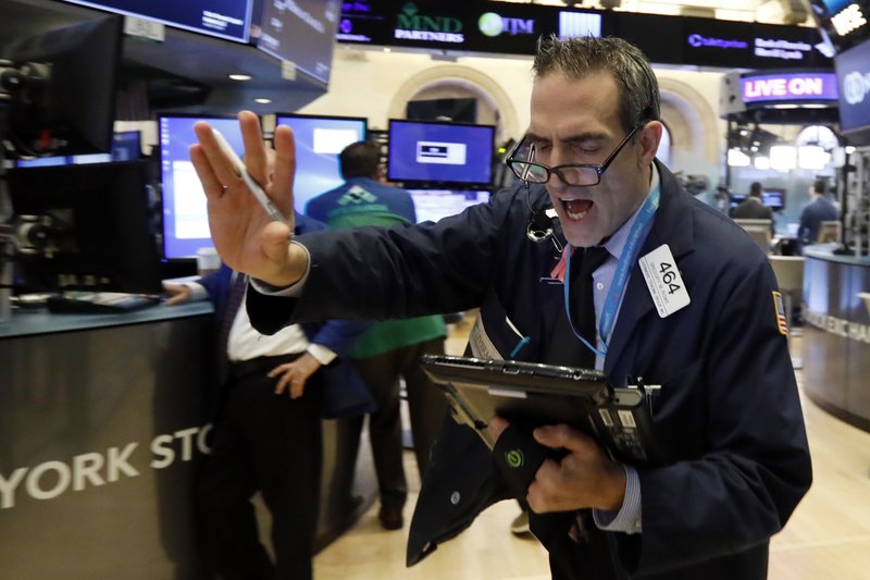 Trader Gregory Rowe works on the floor of the New York Stock Exchange, Wednesday, Nov. 7, 2018. Stocks are climbing in early trading on Wall Street as results of the U.S. midterm elections came in as investors had expected. (AP Photo/Richard Drew)

