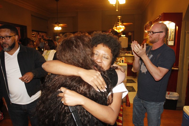 Veronica Smith-Creer hugs supporters during her victory party Tuesday at the Union County Democratic headquarters at the corner of Jefferson and Elm.
