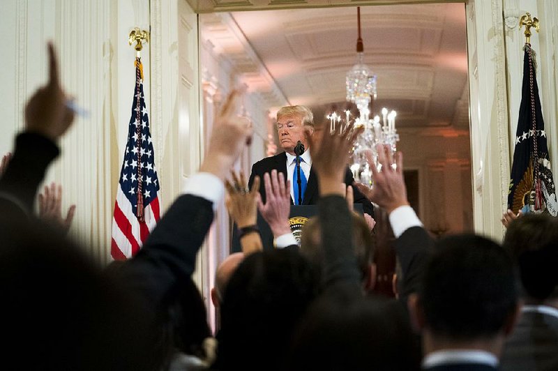 President Donald Trump takes questions Wednesday at a news conference at the White House. While
praising Democratic House leader Nancy Pelosi, Trump warned that if Democrats begin investigating
him, he will adopt a “warlike posture” and have Senate Republicans investigate the Democrats.