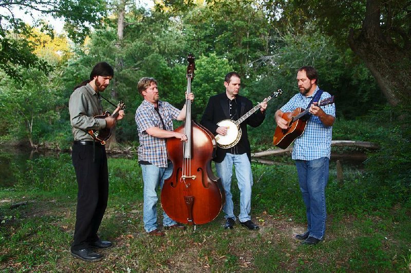 Runaway Planet — (from left) Matthew Stone, Michael Proveaux, Steve Brauer and Greg Alexander — performs Friday at the Old State House in Little Rock.
