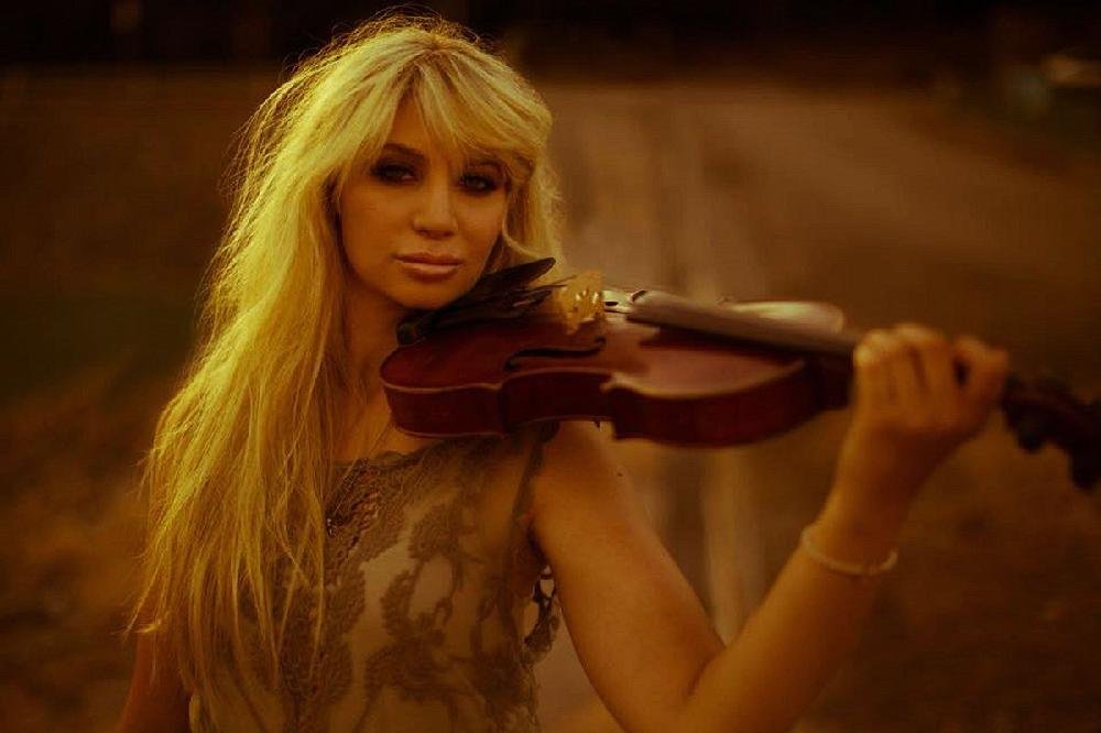 Lacie Carpenter performs at the Boomtown Opry Saturday at the El Dorado Municipal Auditorium.
