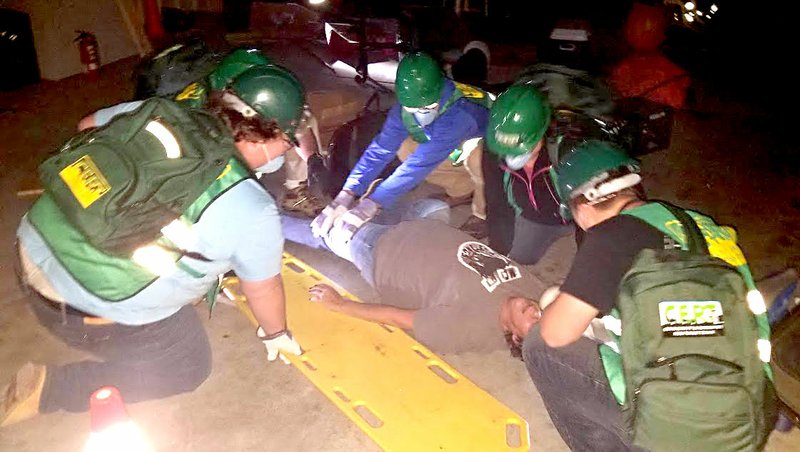 Courtesy photo Newly trained CERT volunteers attend to &quot;victim&quot; Kim Bell during an exercise at the Pineville Fire Station. Approximately 130 to 140 volunteers are now trained to help McDonald County during a disaster.