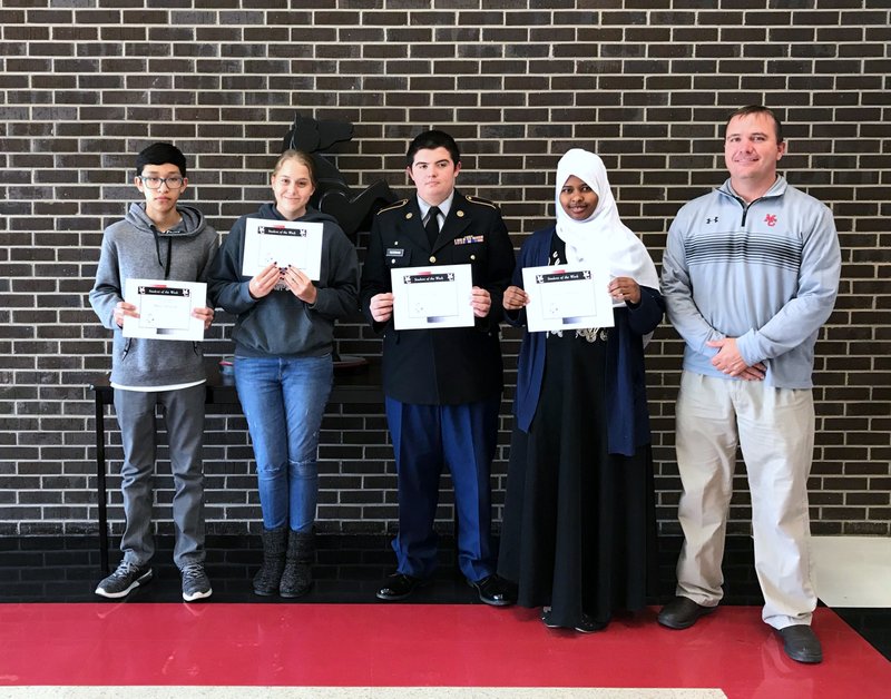 Photo Submitted MCHS Students for the week of Oct. 29-Nov. 2 are freshman Marlo Arreola (left), sophmore Caitlyn Lee, junior Bradley Testerman, senior Ayn Warsame and Mr. Gordon.