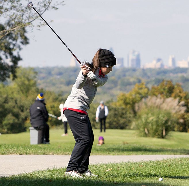 Courtesy Photo Lily Allman hits a shot towards the Kansas City skyline during the Missouri Class 2 Girls State Golf Tournament at Swope Memorial Golf Course.