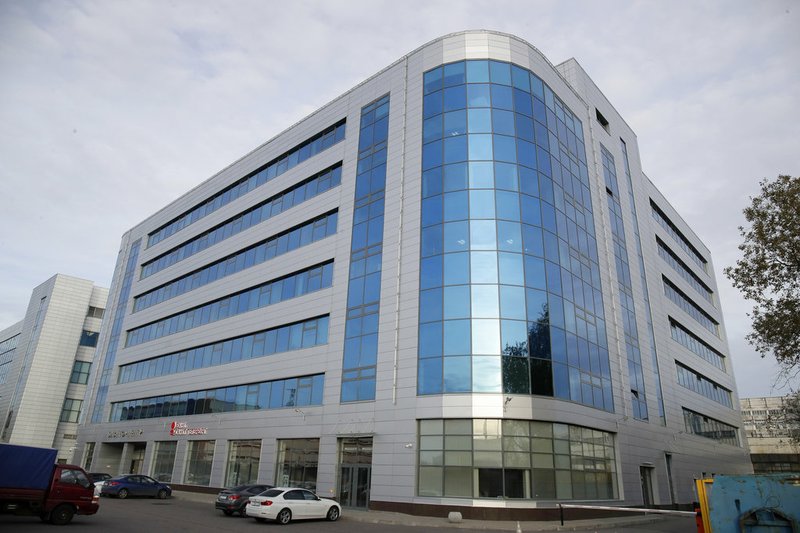 FILE - This Saturday, Oct. 20, 2018 file photo shows a business center building known as the "troll factory", an Internet Research Agency, one of a web of companies allegedly controlled by Yevgeny Prigozhin, who has reported ties to Russian President Vladimir Putin, in St. Petersburg, Russia. Federal cybersecurity officials aren't aware of any voting system compromises by Russia or other foreign agents during the midterm elections. But it's not entirely clear why or whether hackers are saving their gun powder for the 2020 presidential showdown.(AP Photo/Dmitri Lovetsky, File) story.lead_photo.caption