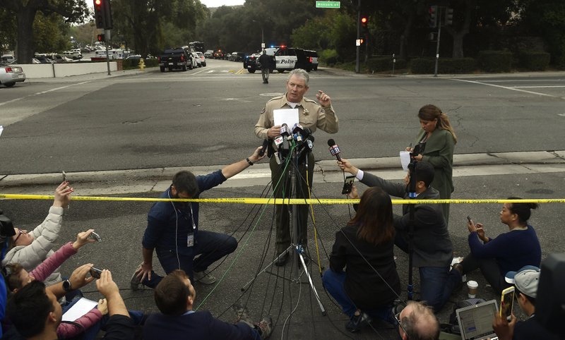 Ventura County Sheriff Geoff Dean speaks to reporters near the scene in Thousand Oaks, Calif., on Thursday, Nov. 8, 2018, where a gunman opened fire the previous night inside a country dance bar crowded with hundreds of people. Ventura County sheriff's spokesman says gunman is dead inside the bar. (AP Photo/Mark J. Terrill)

