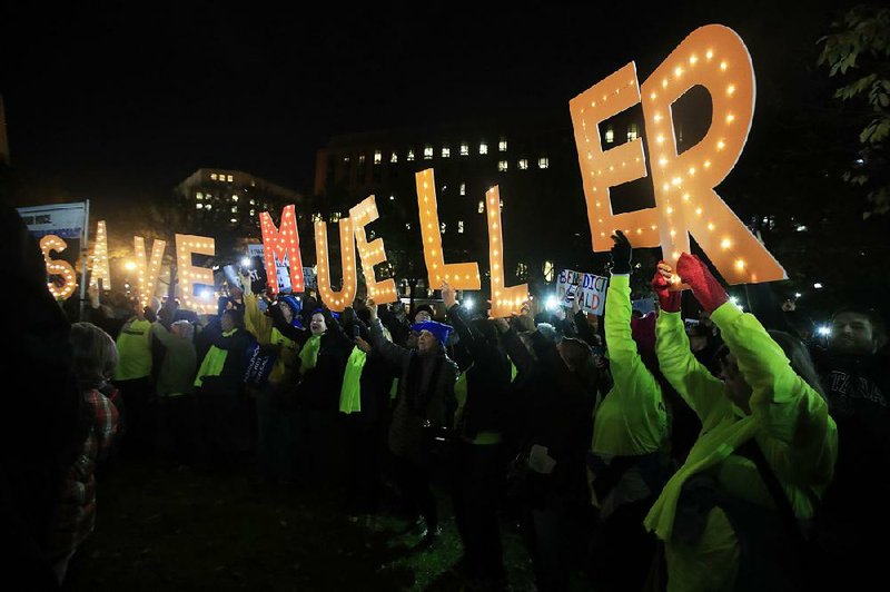 Protesters gather Thursday evening outside the White House as part of a nationwide “Protect Mueller” campaign demanding that acting Attorney General Matthew Whitaker recuse himself from oversight of special counsel Robert Mueller’s Russia investigation. Whitaker said he has no plans to recuse. 